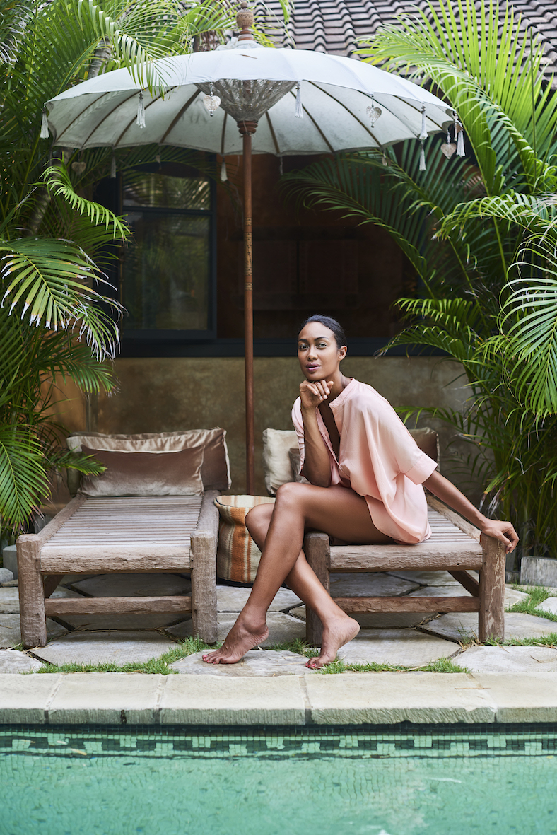 Balistarz-model-Hasina-spend-her-time-at-the-sun-bed-near-the-villa-pool-wearing-pink-shirt-dress-by-sassind-travel-wear