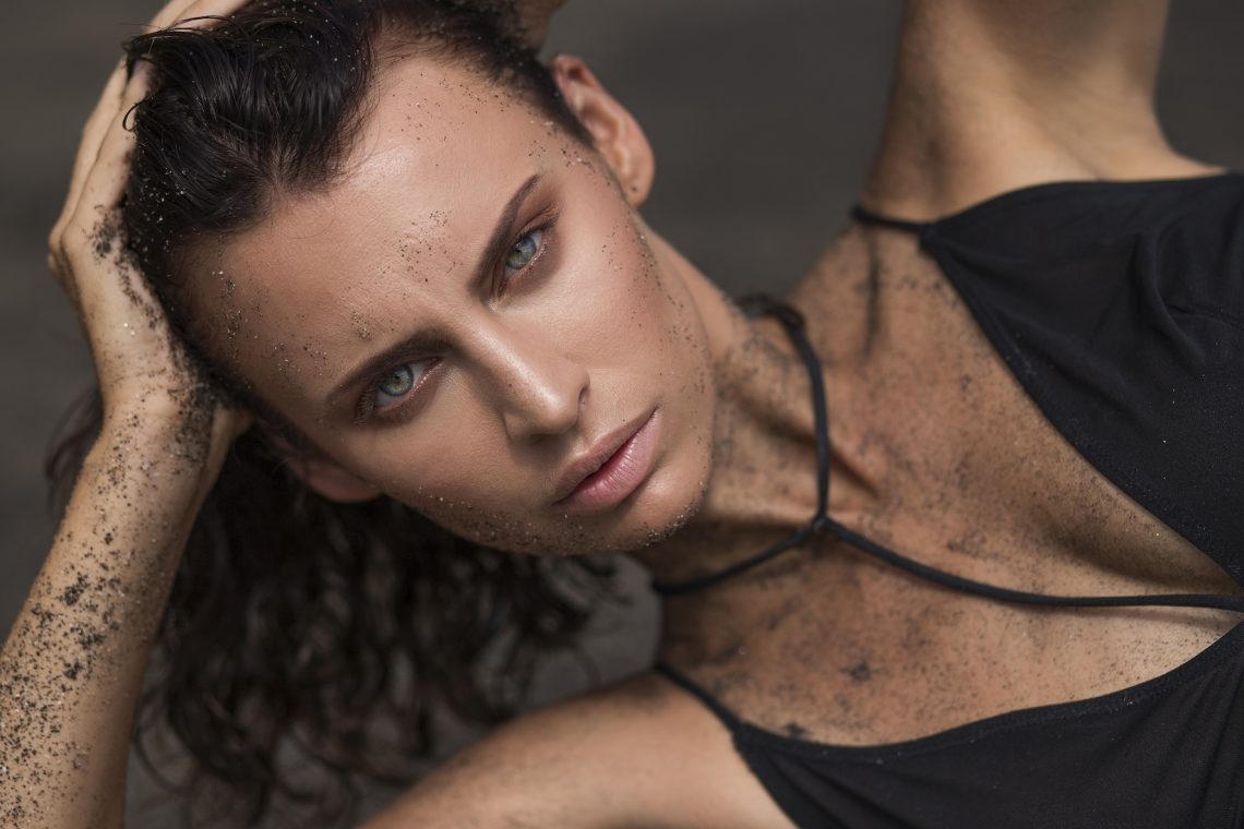 Balistarz-model-Irina-Kro-landscape-shoot-laying-down-with-sand-and-a-black-bikini