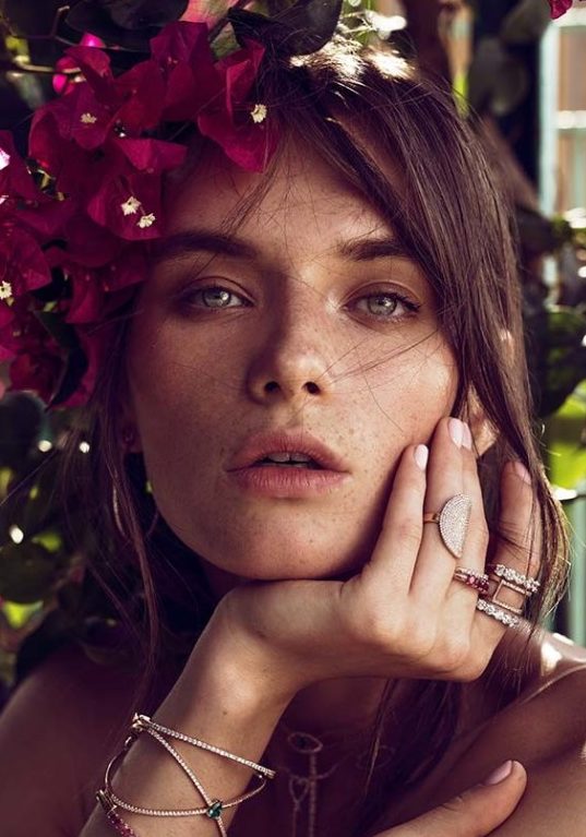 Balistarz-model-Lisa-Ababkova-portrait-headshot-with-purple-flowers-rings-and-a-bracelet