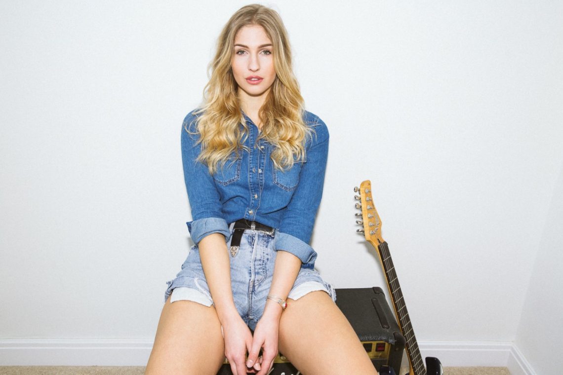 Balistarz-model-Rachel-Bowler-landscape-shoot-sitting-on-a-speaker-and-a-guitar