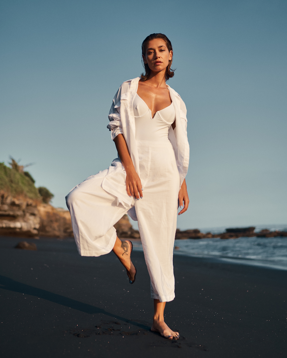 Balistarz-model-Raluca-Cojocaru-portrait-beach-shoot-doing-a-single-leg-stand-on-the-gorgeous-black-sand