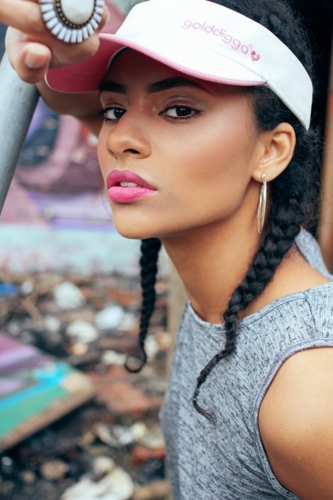Balistarz-model-Rocky-Brower-portrait-shot-bold-pink-lipstik-wearing-golddigga-hat