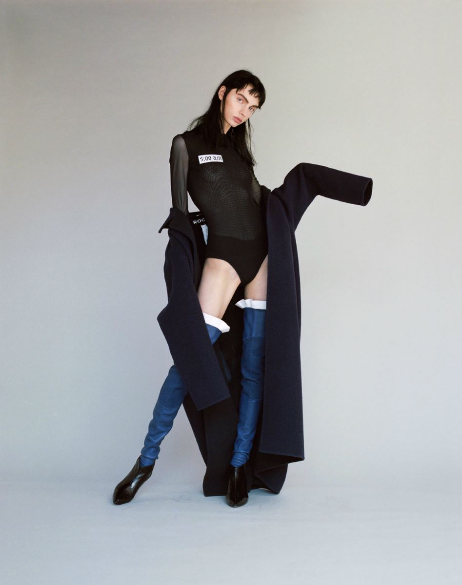 Balistarz-model-Tina-Veshagura-portrait-shoot-with-black-coat-with-shirt-that-says-5:00-AM